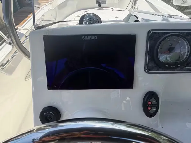 Slide: The Image of Dashboard of a 2024 Boston Whaler 17 Montauk with Simrad display. - 9