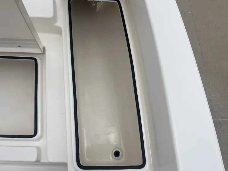 Slide: The Image of Pathfinder 2400 boat storage compartment, 2022 model, empty with drain. - 16
