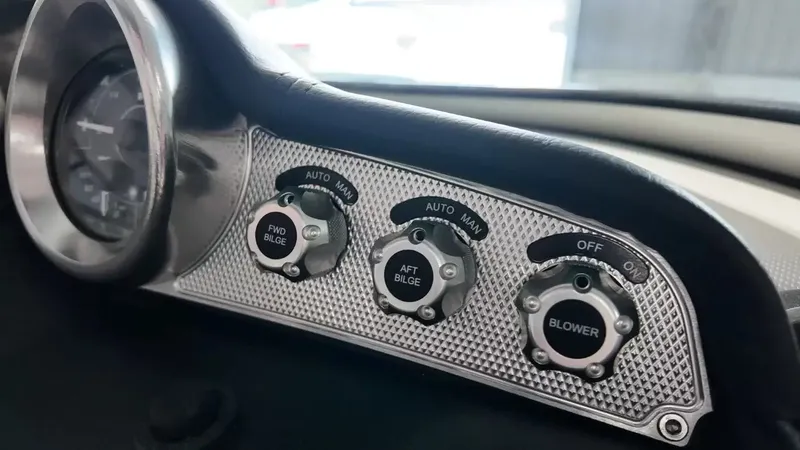 Slide: The Image of Dashboard of a 2012 MasterCraft X-45 with bilge and blower controls. - 22