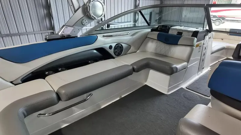Slide: The Image of Interior of a 2012 MasterCraft X-45 boat with blue and gray seating. - 27