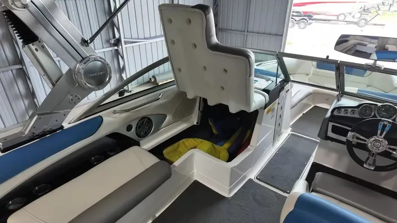 Slide: The Image of Interior of a 2012 MasterCraft X-45 boat with steering wheel and seats. - 28