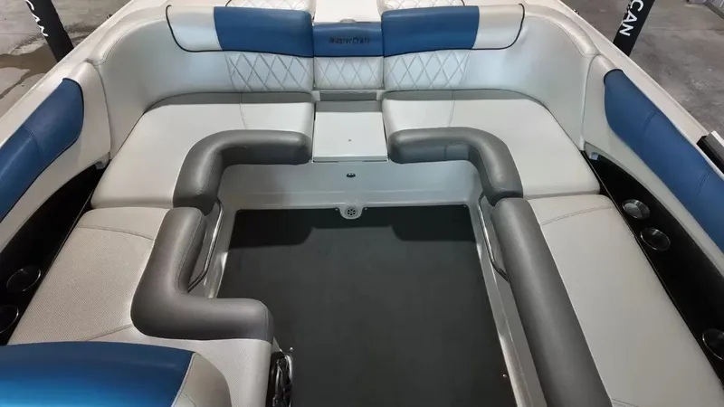 Slide: The Image of Interior of a 2012 MasterCraft X-45 boat with blue and gray seating. - 31