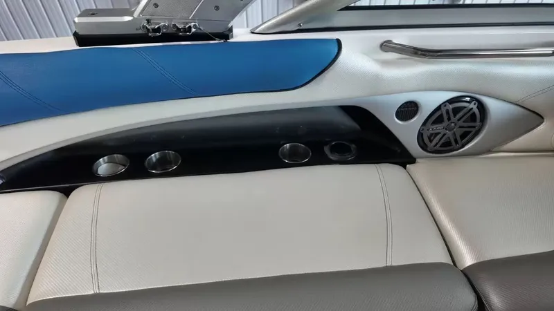 Slide: The Image of Interior of a 2012 MasterCraft X-45 boat with speaker and cup holders. - 32