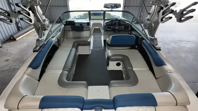 Slide: The Image of Interior of a 2012 MasterCraft X-45 boat with blue and white seating. - 33