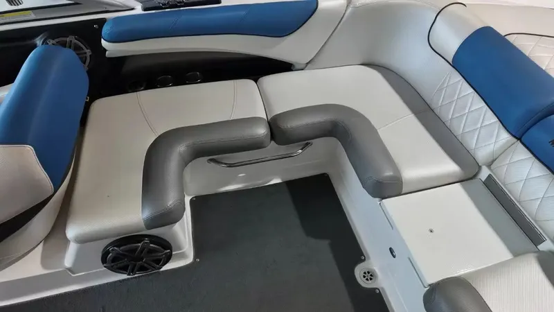 Slide: The Image of Interior of a 2012 MasterCraft X-45 boat with blue and gray seating. - 34