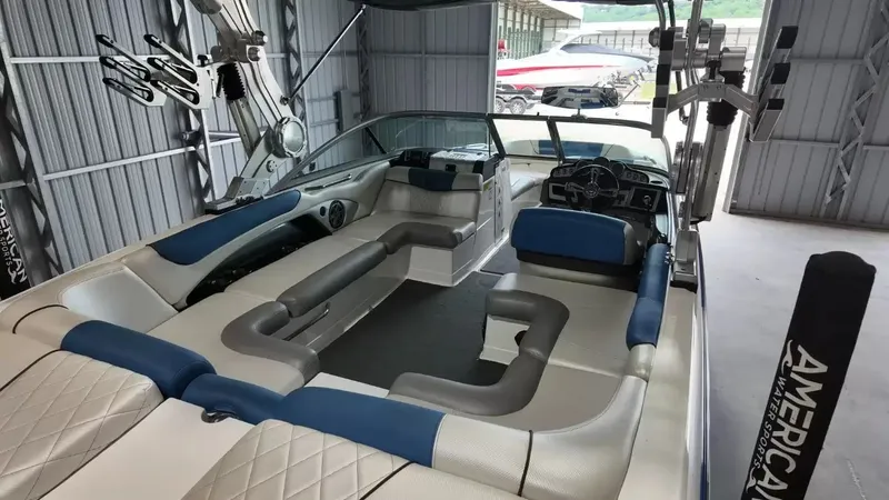 Slide: The Image of Interior view of a 2012 MasterCraft X-45 boat in a garage. - 35