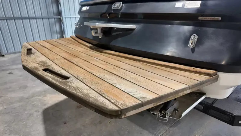 Slide: The Image of 2012 MasterCraft X-45 boat with wooden platform in warehouse. - 4