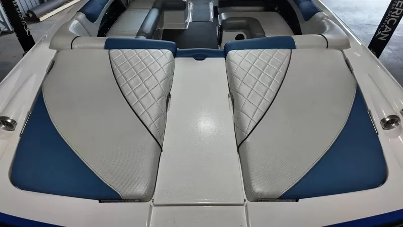 Slide: The Image of Interior of a 2012 MasterCraft X-45 boat with blue and gray seating. - 40