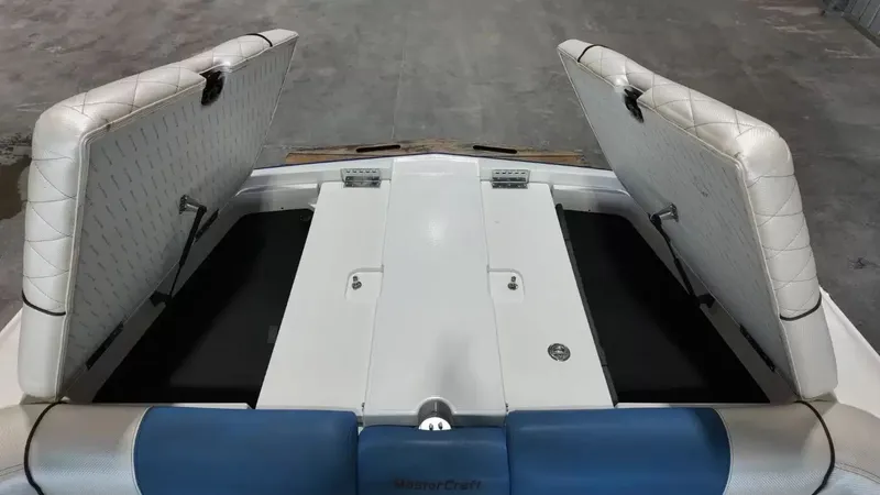 Slide: The Image of 2012 MasterCraft X-45 boat with open storage compartments. - 41