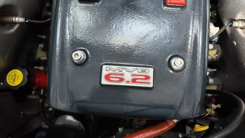 Slide: The Image of MasterCraft X-45 2012 engine cover with MV8 6.2 emblem. - 43