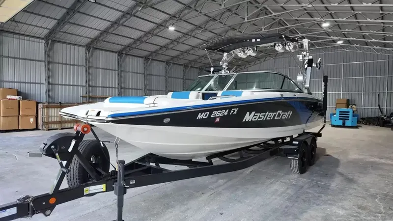 Slide: The Image of 2012 MasterCraft X-45 boat in warehouse on trailer. - 9