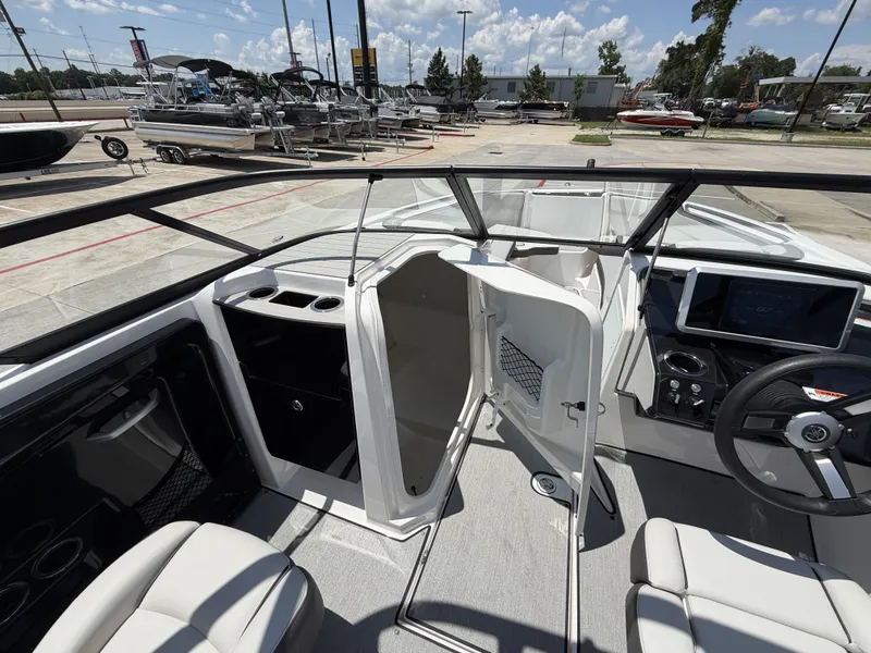 Slide: The Image of Interior view of 2024 Yamaha AR250 boat with helm station. - 21
