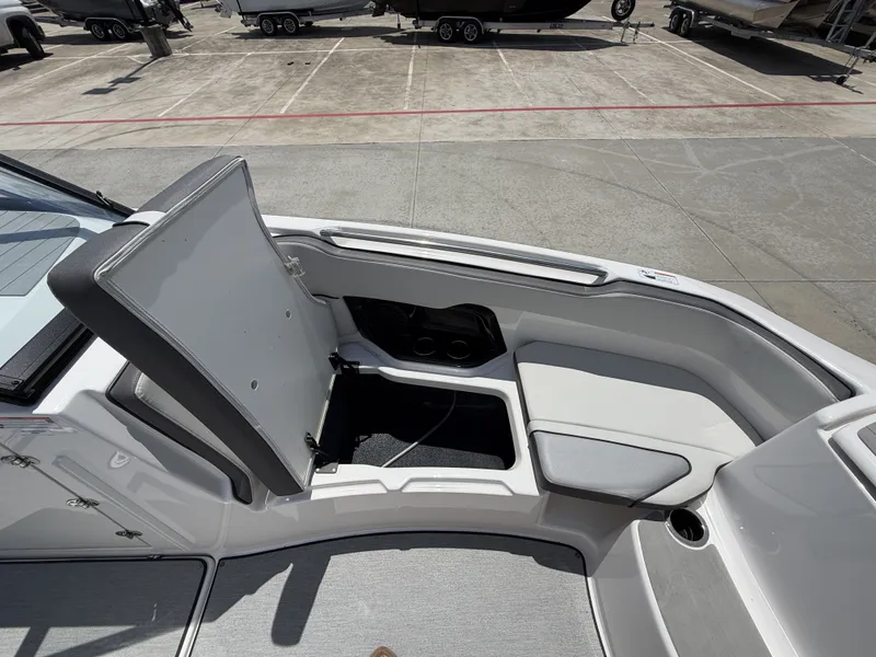 Slide: The Image of Interior of 2024 Yamaha AR250 boat with storage compartment. - 32