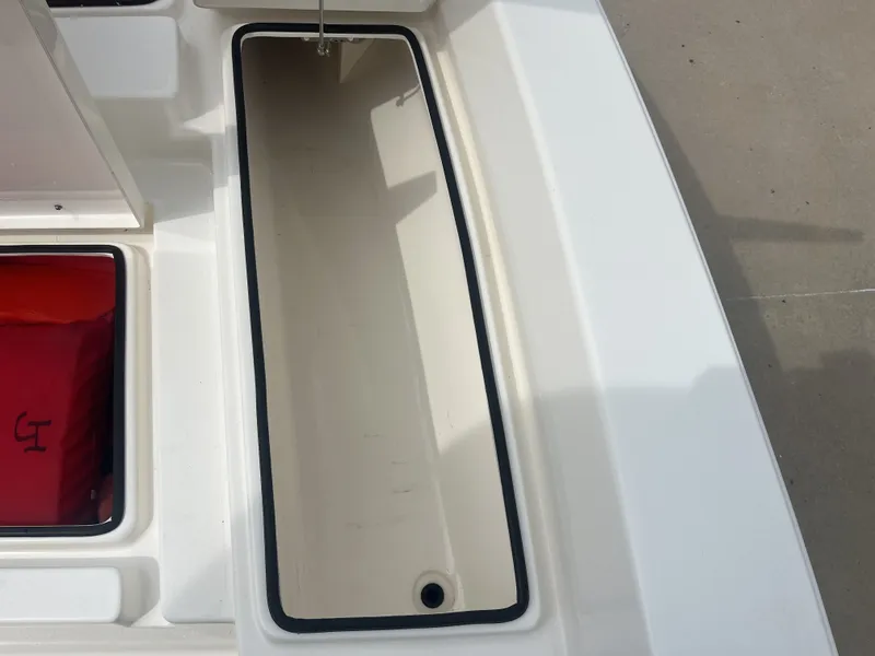 Slide: The Image of Pathfinder 2400 boat storage compartment, 2022 model, open view. - 14