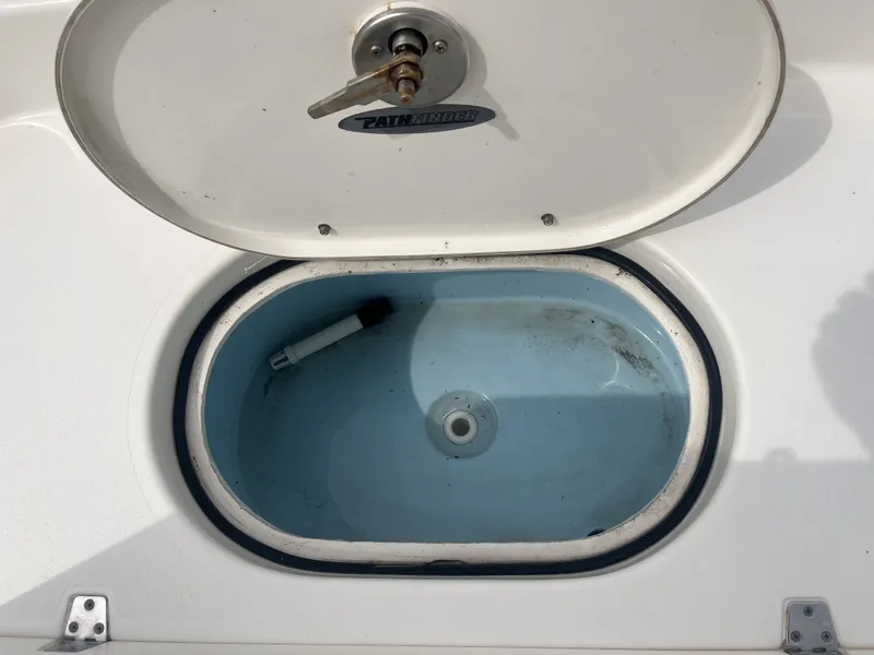 Slide: The Image of Open storage hatch of a 2022 Pathfinder 2400 boat. - 15
