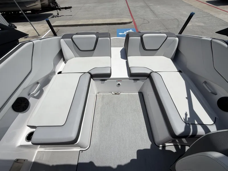 Slide: The Image of Interior of 2024 Yamaha AR250 boat with gray cushioned seating. - 13