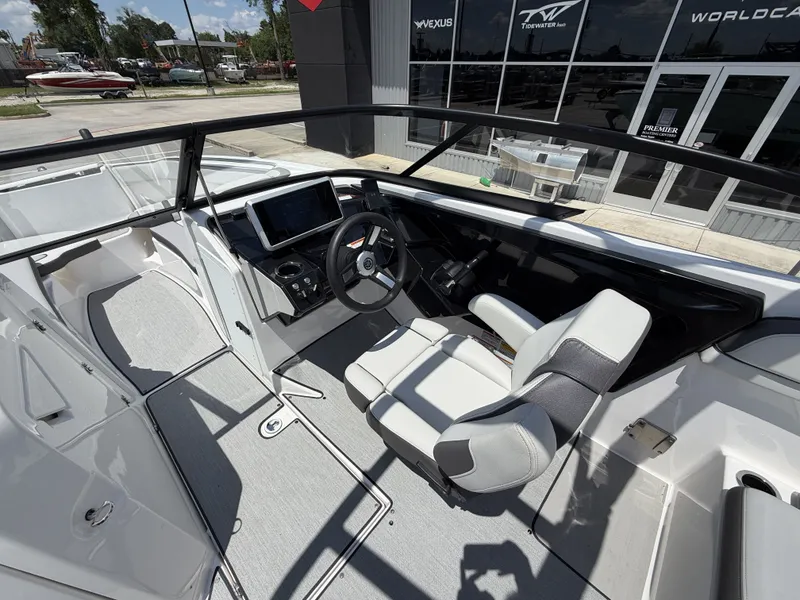 Slide: The Image of Interior of 2024 Yamaha AR250 boat with modern helm console. - 22