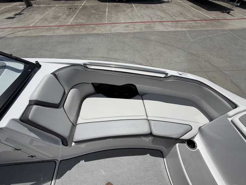 Slide: The Image of 2024 Yamaha AR250 boat with gray and white seating cushions. - 31
