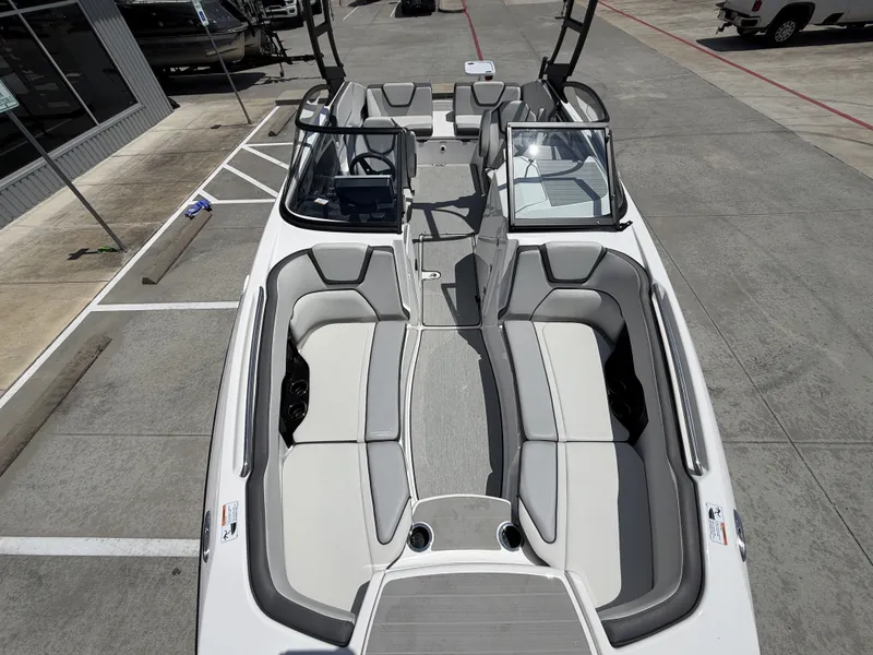 Slide: The Image of Interior view of 2024 Yamaha AR250 boat, gray and white upholstery. - 33