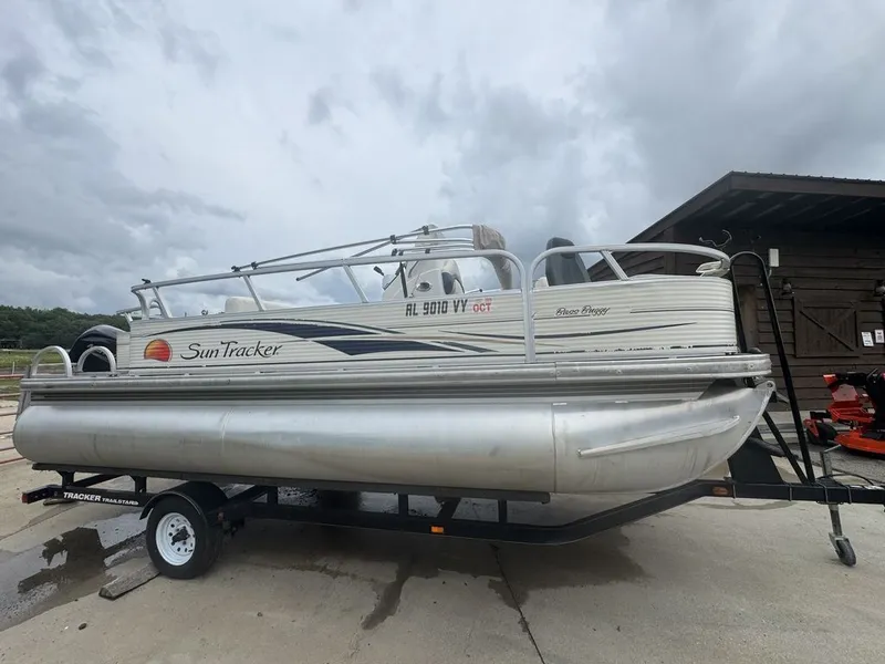 The Image of 2020 Sun Tracker Party Barge 22 RF DLX on trailer, cloudy sky. - 0