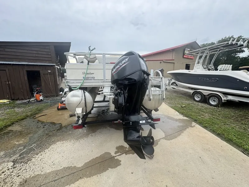 Slide: The Image of 2020 Sun Tracker Party Barge 22 RF DLX with outboard motor. - 3