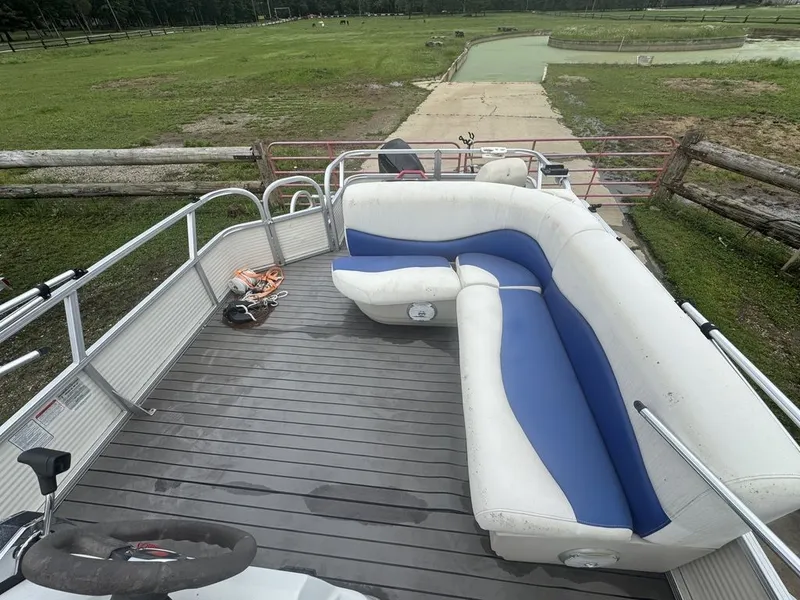 Slide: The Image of 2020 Sun Tracker Party Barge 22 RF DLX on a grassy field. - 4