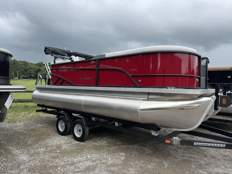The Image of 2026 Crest SE Cruise 220 pontoon boat on trailer, red design. - 0