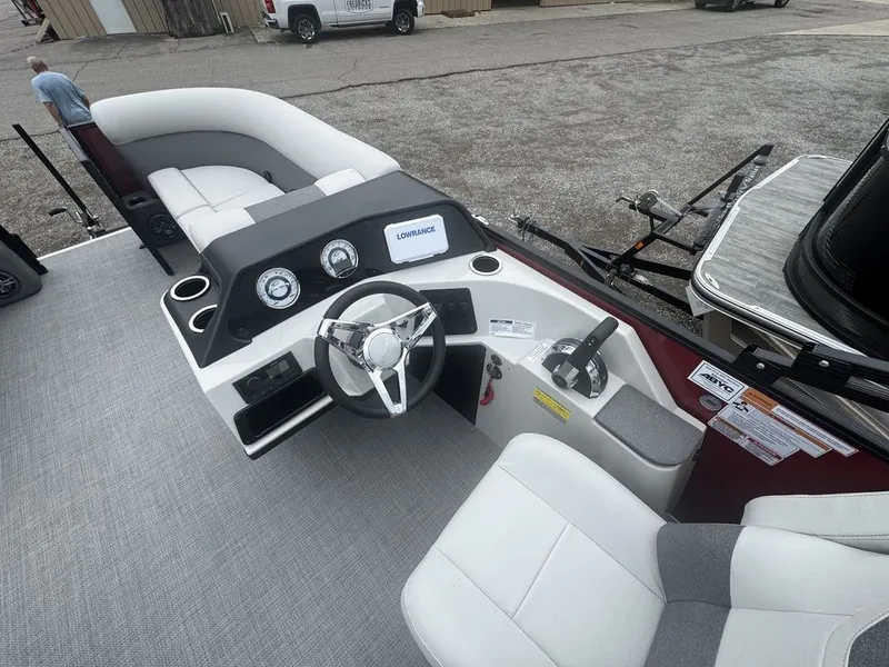 Slide: The Image of Interior view of 2026 Crest SE Cruise 220 boat with steering console. - 5