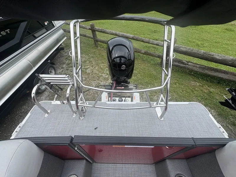 Slide: The Image of Crest SE Cruise 220 boat 2026 with outboard motor and ladder. - 9