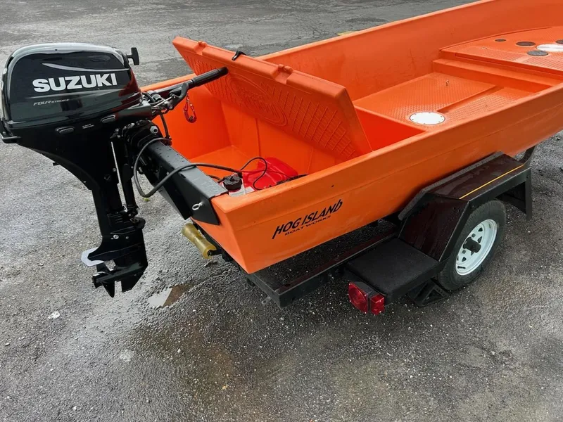 Slide: The Image of 2024 Hog Island SW16 boat with Suzuki outboard motor. - 5