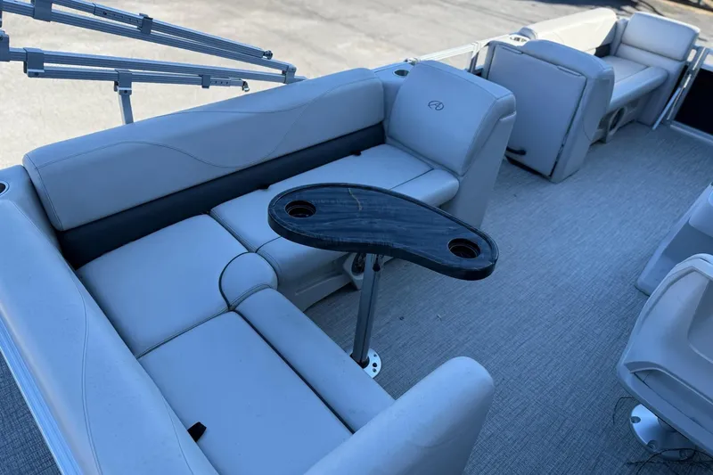 Slide: The Image of Interior of a 2021 Avalon VTX Cruise boat with gray seating. - 7