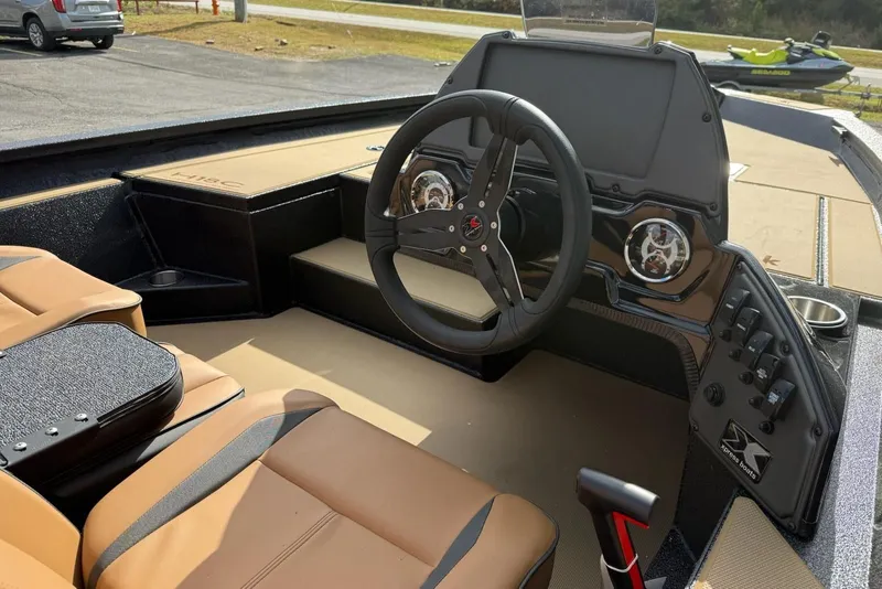 Slide: The Image of Interior of 2026 Xpress H18C Crappie with steering wheel and dashboard. - 4