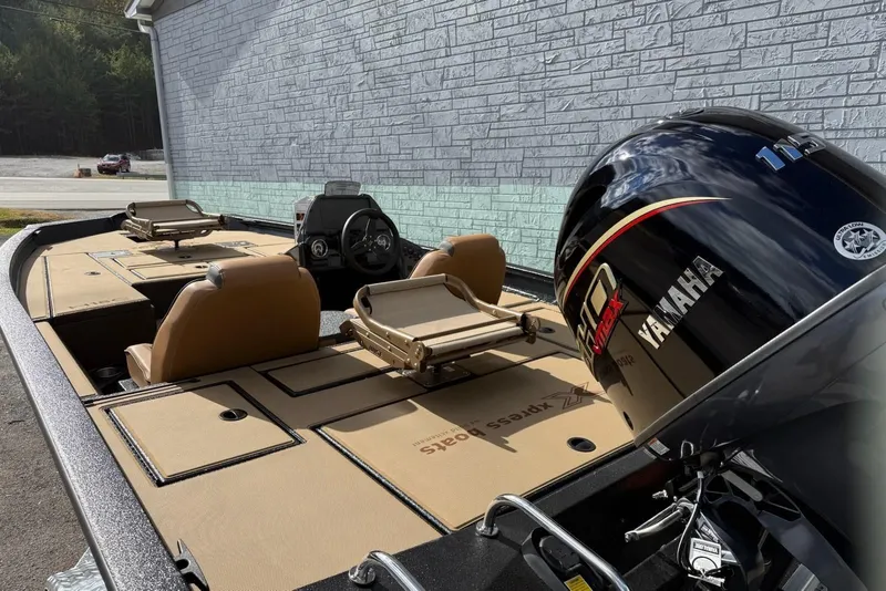 Slide: The Image of 2026 Xpress H18C Crappie boat with Yamaha motor, beige seats. - 8