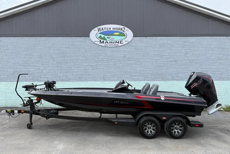 The Image of iKon vls20 boat 2026 in front of marine shop. - 1