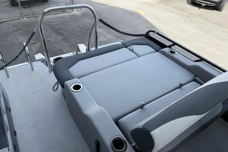 Slide: The Image of 2026 Avalon 2385 LSZ Entertainer boat with gray upholstery and cup holders. - 8