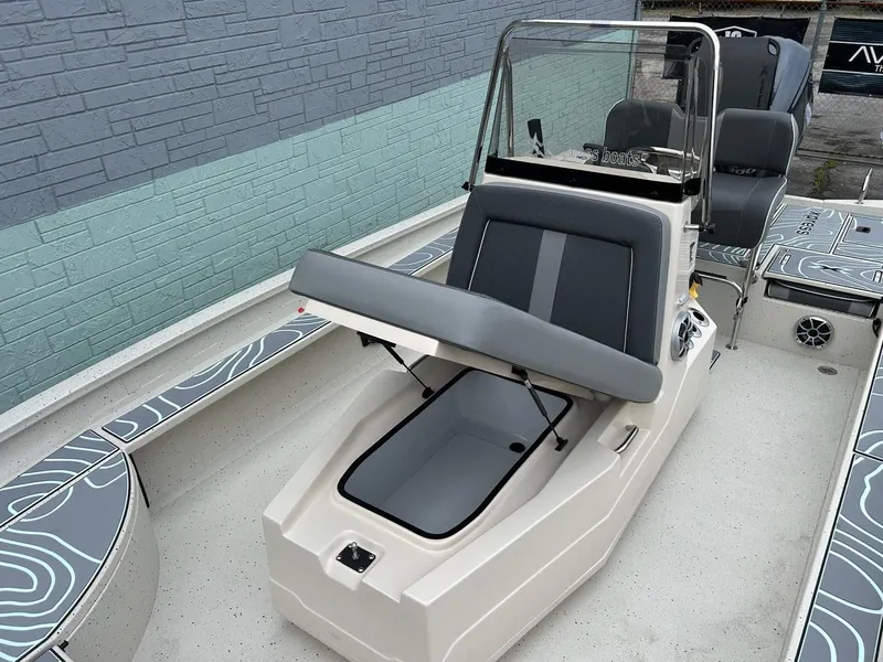 Slide: The Image of 2025 Xpress X23 Bay Lounge boat with seating and storage. - 6