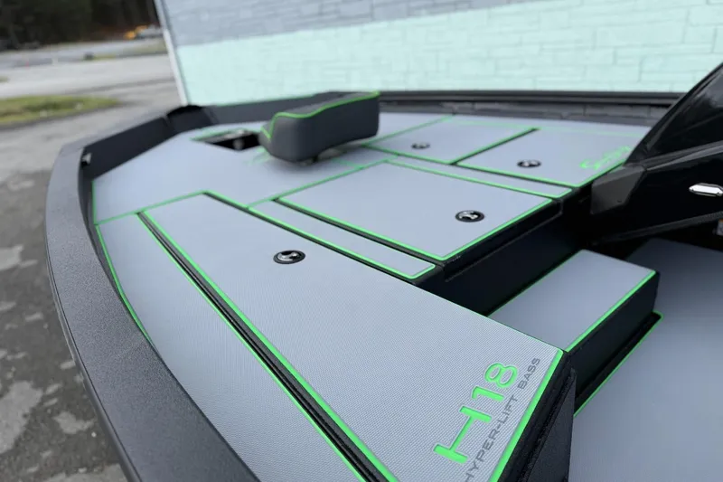 Slide: The Image of Xpress H18 boat 2026 with gray deck and green accents. - 3
