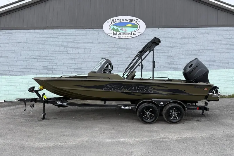 The Image of 2026 SeaArk Protege 200 boat displayed outside marine building. - 1