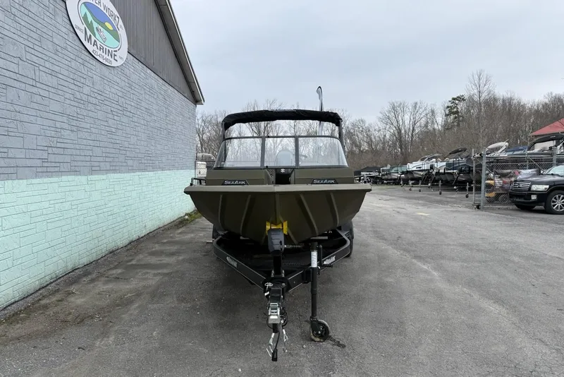 Slide: The Image of 2026 SeaArk Protege 200 boat on trailer outside marine shop. - 3