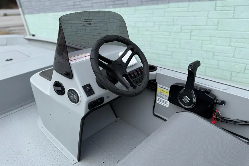 Slide: The Image of Steering console of SeaArk Shadow 18 boat, model year 2026. - 9