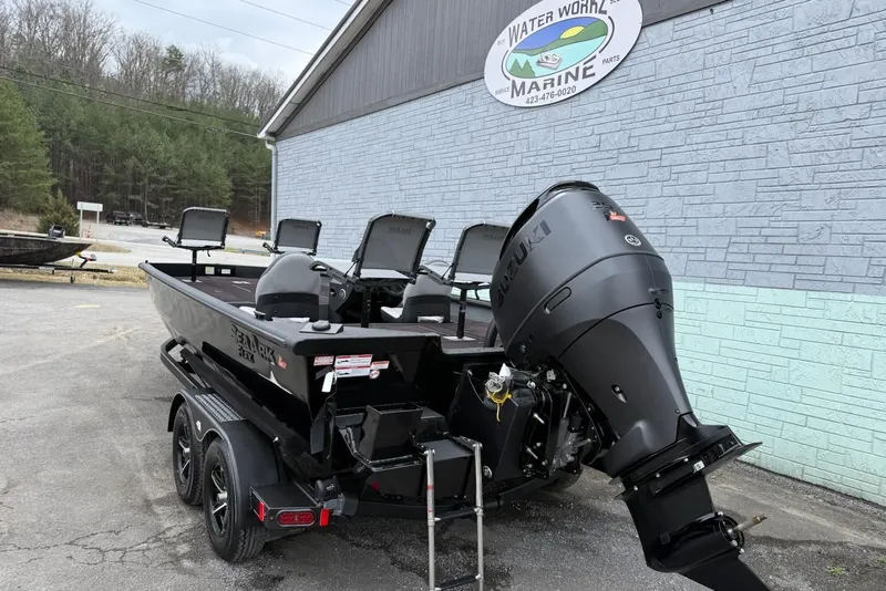 Slide: The Image of 2026 SeaArk Flex 21 Pro boat with Suzuki engine on trailer. - 4