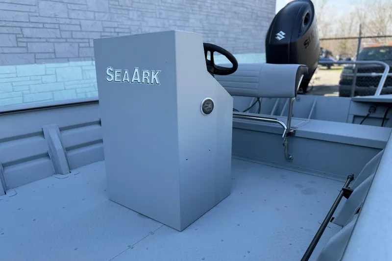 Slide: The Image of 2026 SeaArk 2472 Workhorse boat with steering console and Suzuki motor. - 6