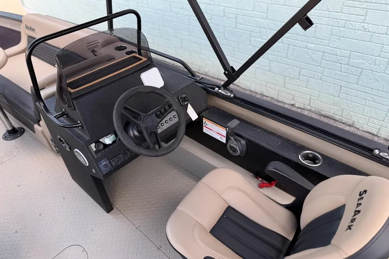Slide: The Image of Interior of 2026 SeaArk Big Easy with steering console and seats. - 12