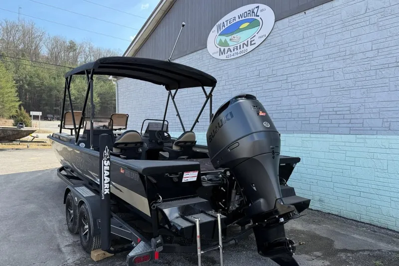 Slide: The Image of 2026 SeaArk Big Easy boat with Suzuki engine, on trailer. - 5