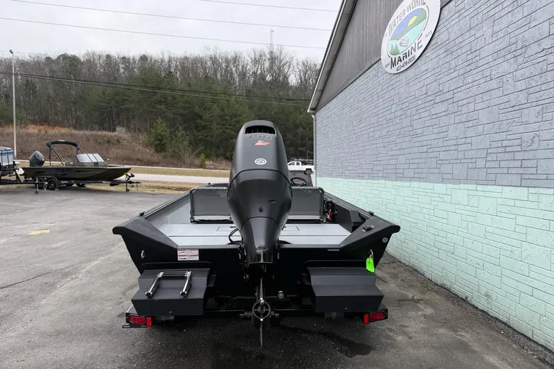 Slide: The Image of Rear view of a 2026 SeaArk Shadow 20 boat in a parking lot. - 5