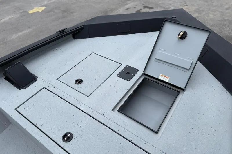 Slide: The Image of 2026 SeaArk Shadow 20 boat deck with storage compartments and covers. - 8