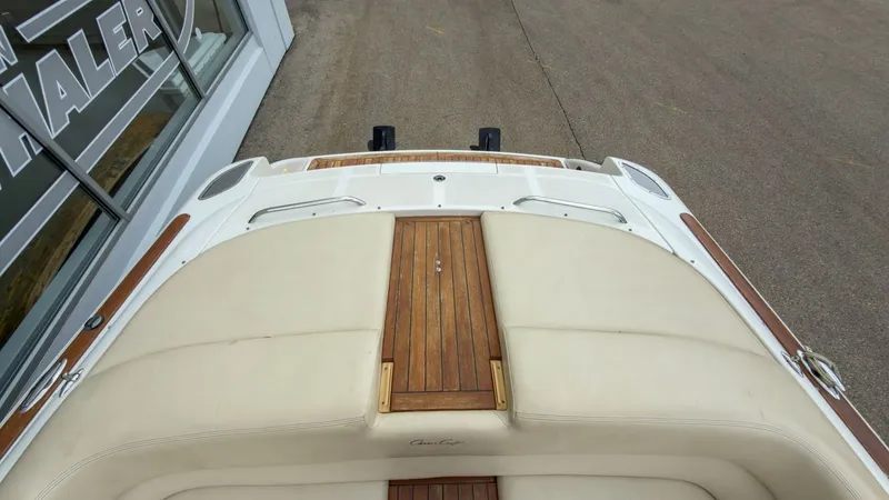 Slide: The Image of 2006 Chris-Craft Launch 28 boat with wooden deck and cushioned seats. - 10