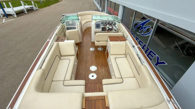 Slide: The Image of Interior view of a 2006 Chris-Craft Launch 28 boat with wooden flooring. - 11