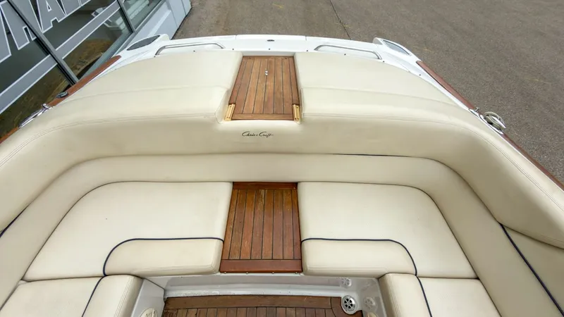 Slide: The Image of Interior of a 2006 Chris-Craft Launch 28 with wood and leather details. - 12