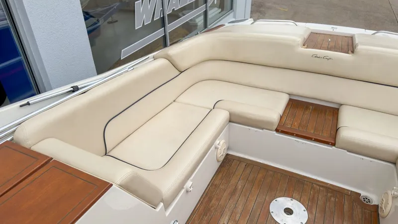 Slide: The Image of Interior of a 2006 Chris-Craft Launch 28 with beige seating. - 13